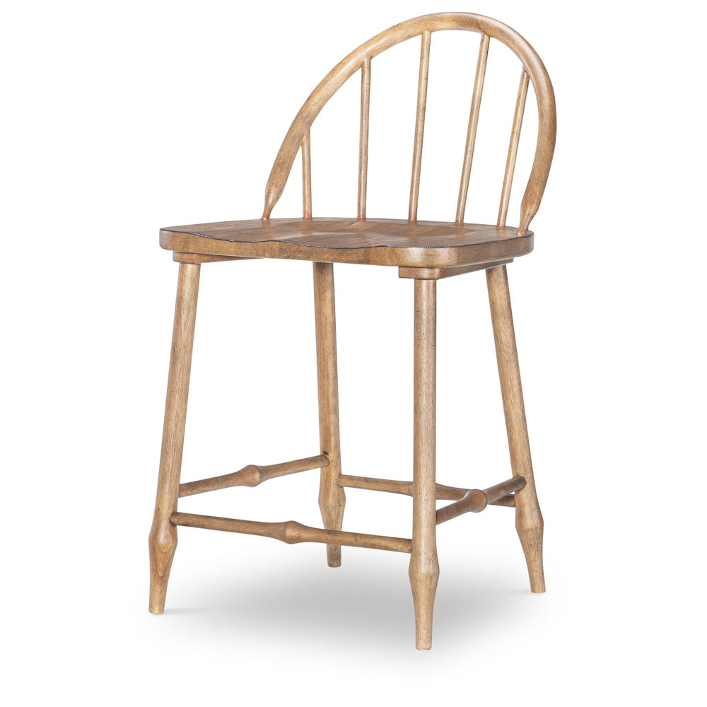 Light-finish wooden Windsor-style counter stool with a curved spindle back and turned legs.