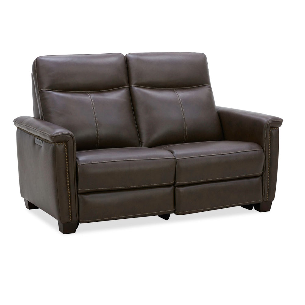 Modern dark brown leather power reclining loveseat with nailhead trim and white stitching.