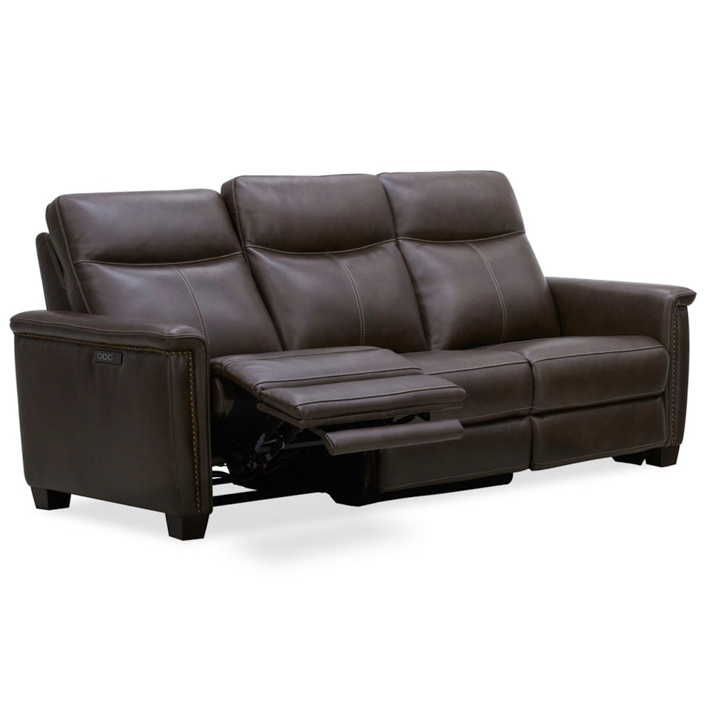 Modern dark brown leather power reclining sofa with adjustable footrest and nailhead trim.