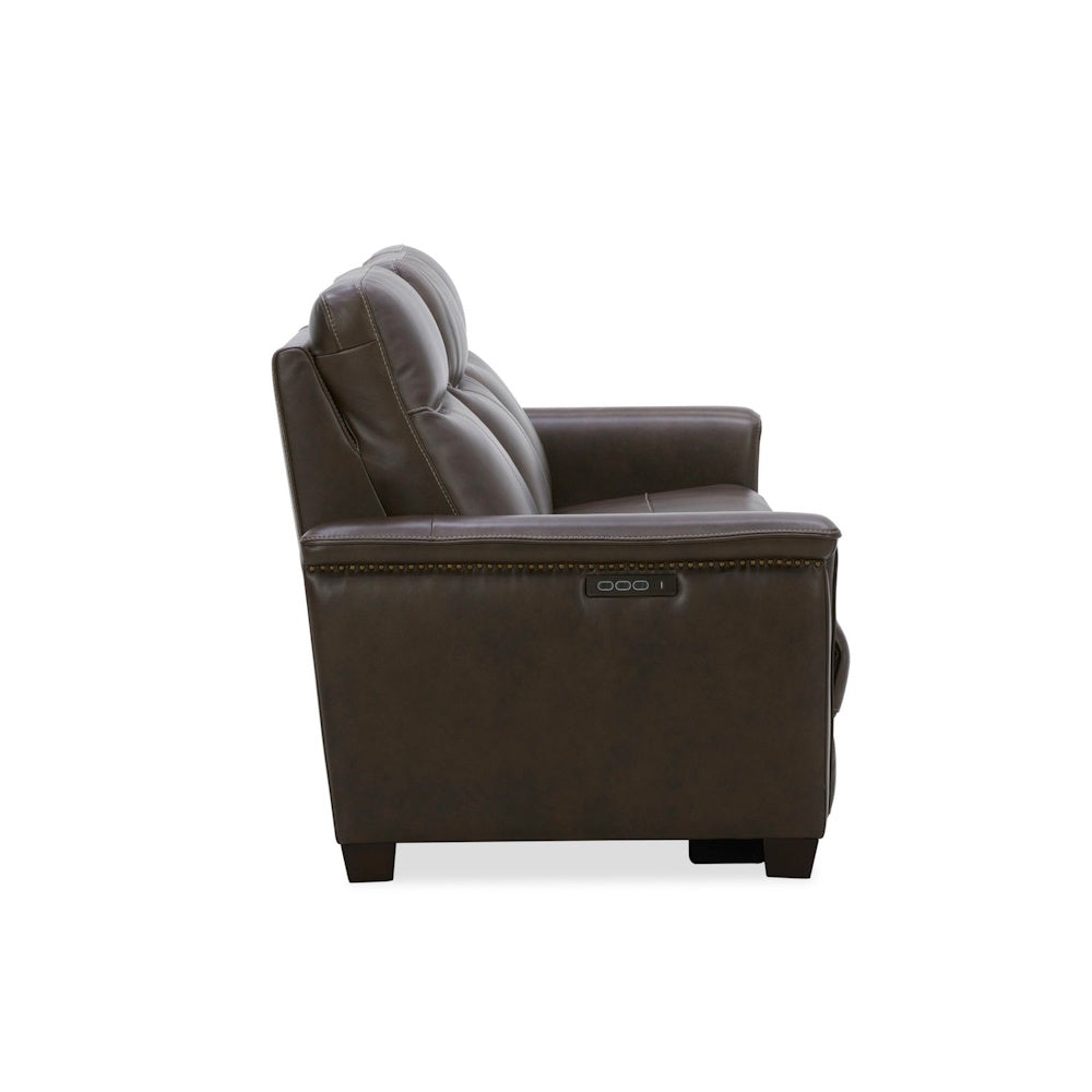 Side view of a brown leather power reclining loveseat with nailhead trim and USB port.