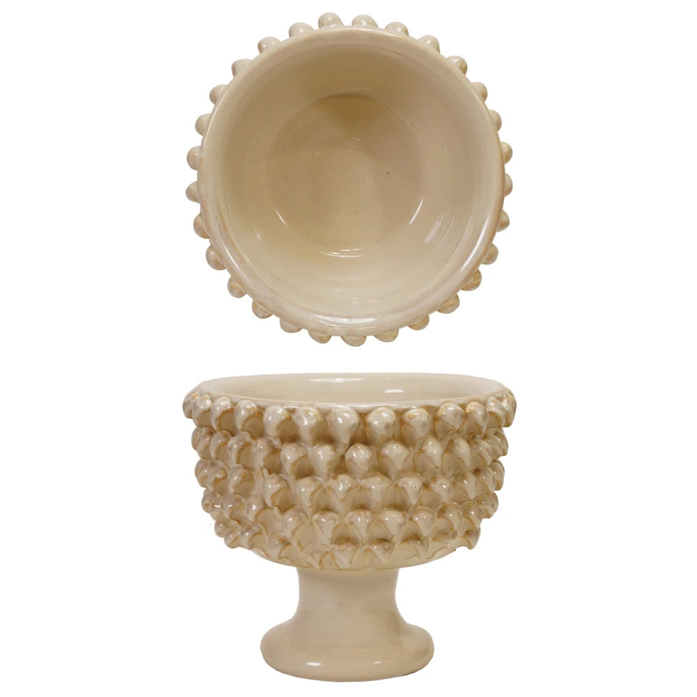 Cream ceramic pedestal bowl with textured scale pattern, top and side views on white background.