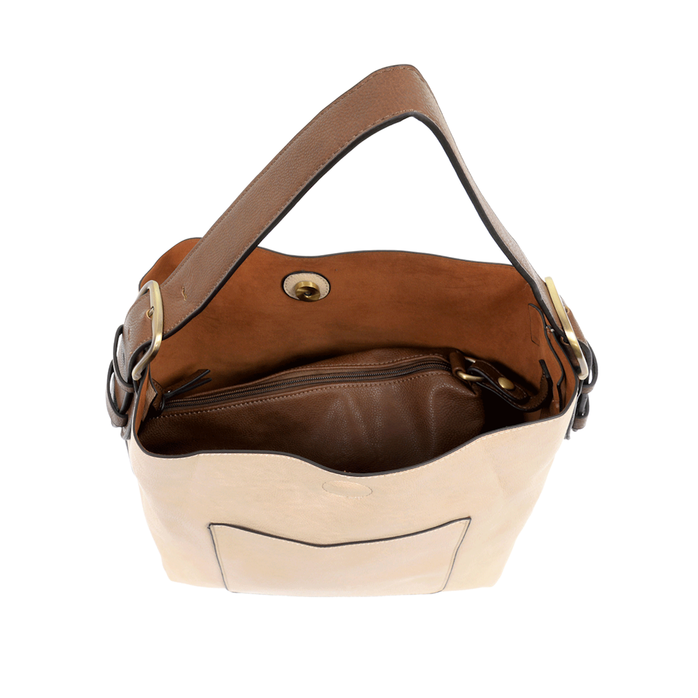 Cream hobo handbag with a brown coffee handle and interior zip pocket on a white background.