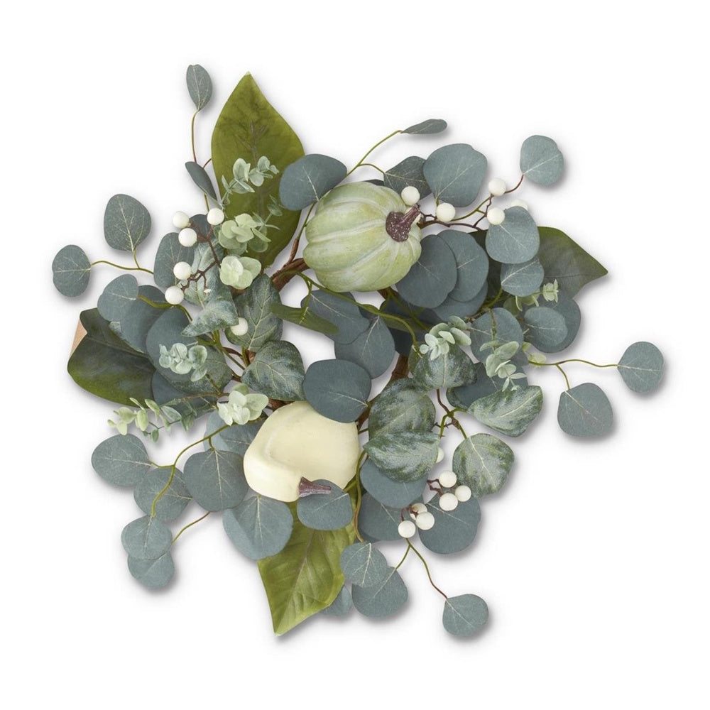 A candle ring wreath featuring eucalyptus leaves, white berries, and small decorative light green and cream pumpkins.