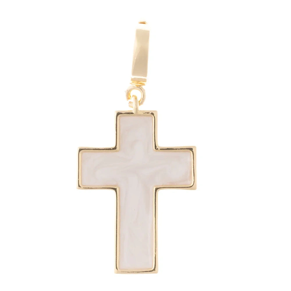 Gold cross pendant charm with white pearlescent enamel fill on a white background.