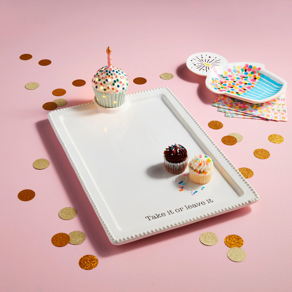 White ceramic serving tray with "Take it or leave it" text, featuring a light-up cupcake sitter and mini chocolate cupcakes.