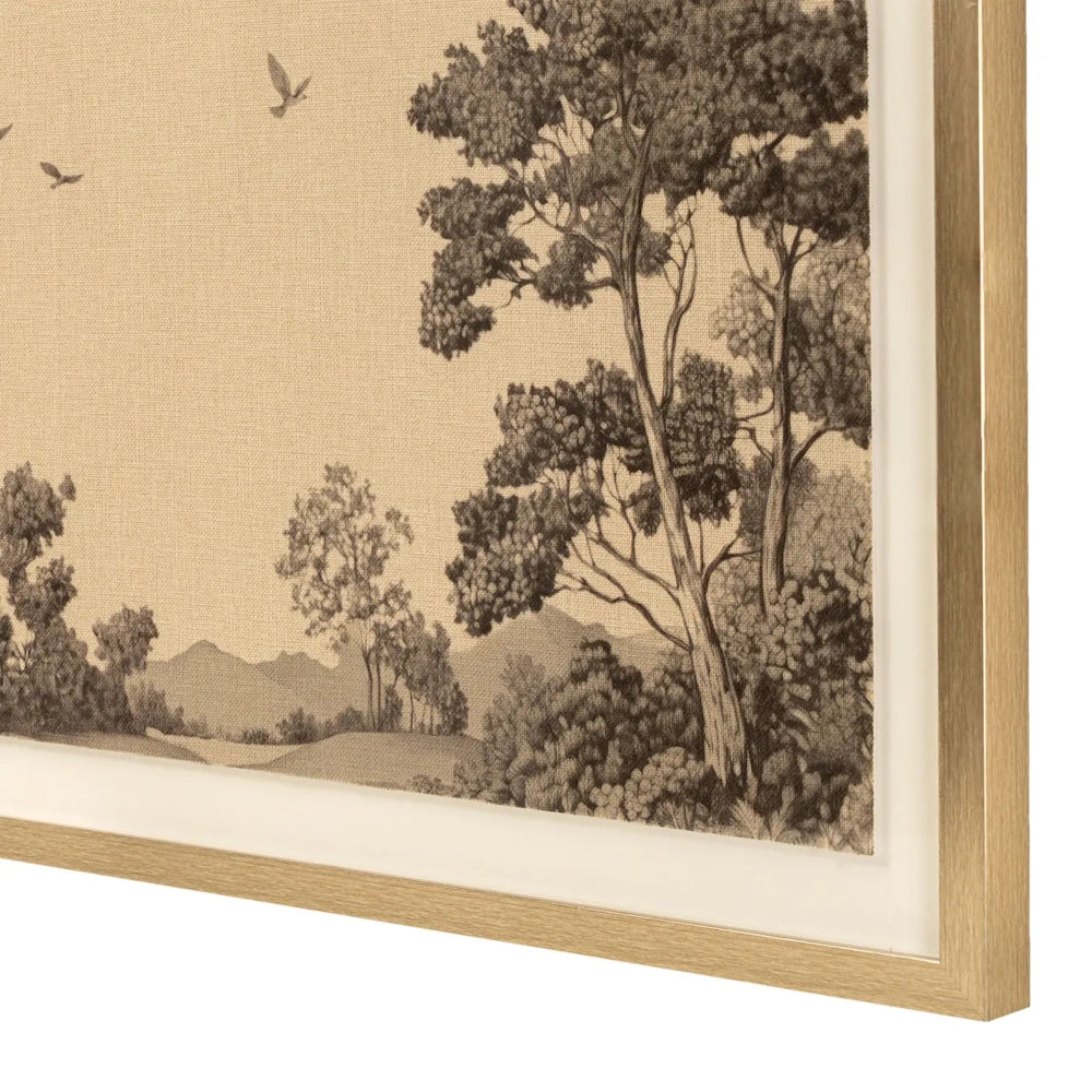 Angled close-up of light gold framed wall art showing a sketched landscape of trees and flying birds.