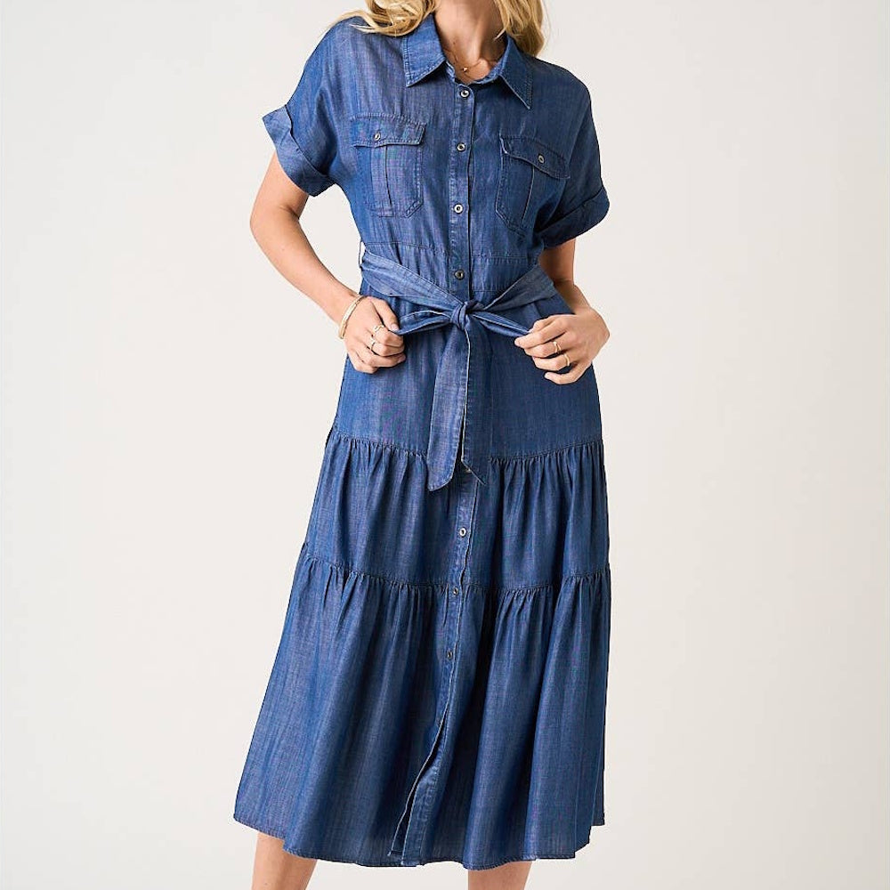 Dark denim washed Tencel chambray maxi shirt dress with a tiered skirt, button front, and tie-waist belt.