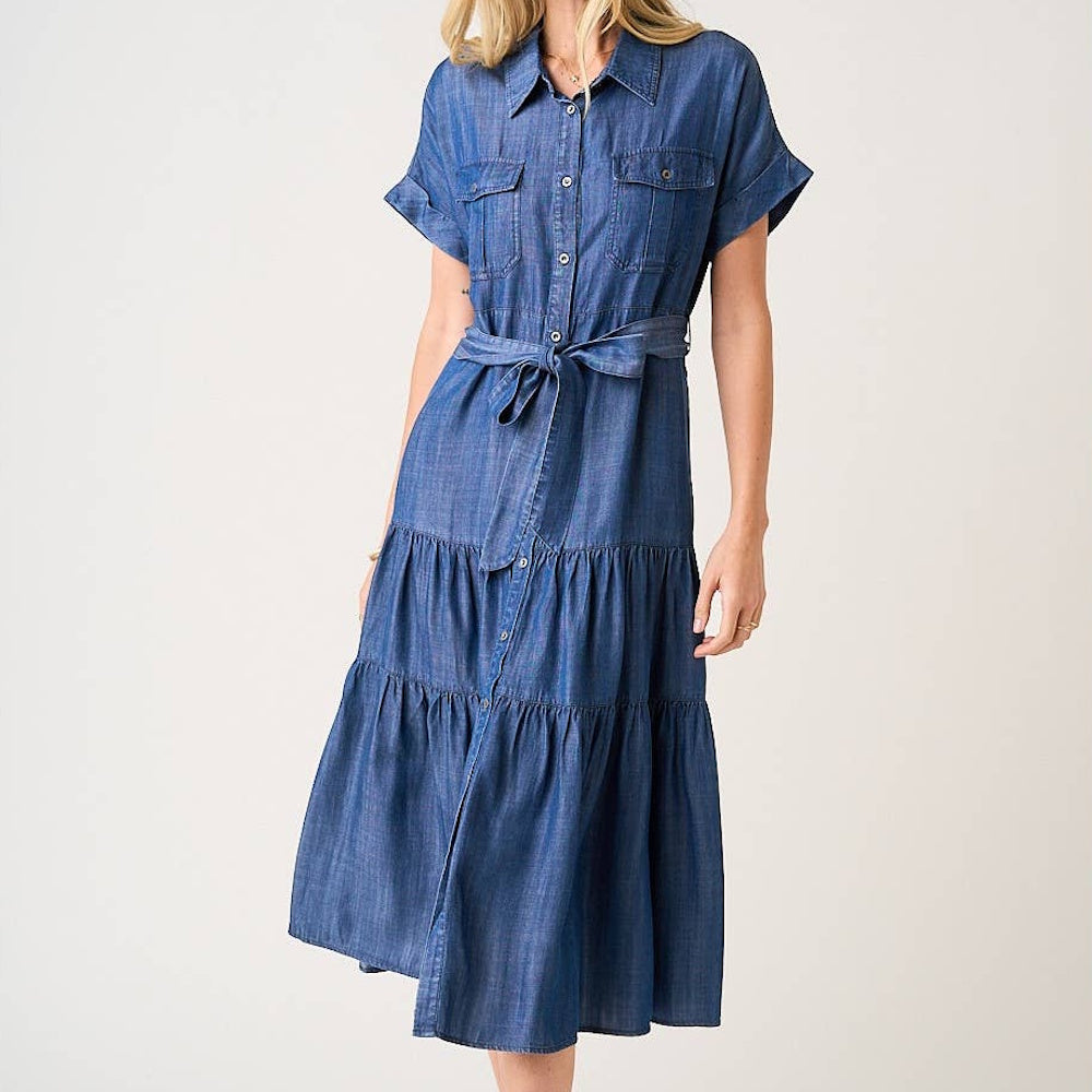 Dark denim washed Tencel chambray maxi shirt dress with tie-waist, tiered skirt, and short sleeves.