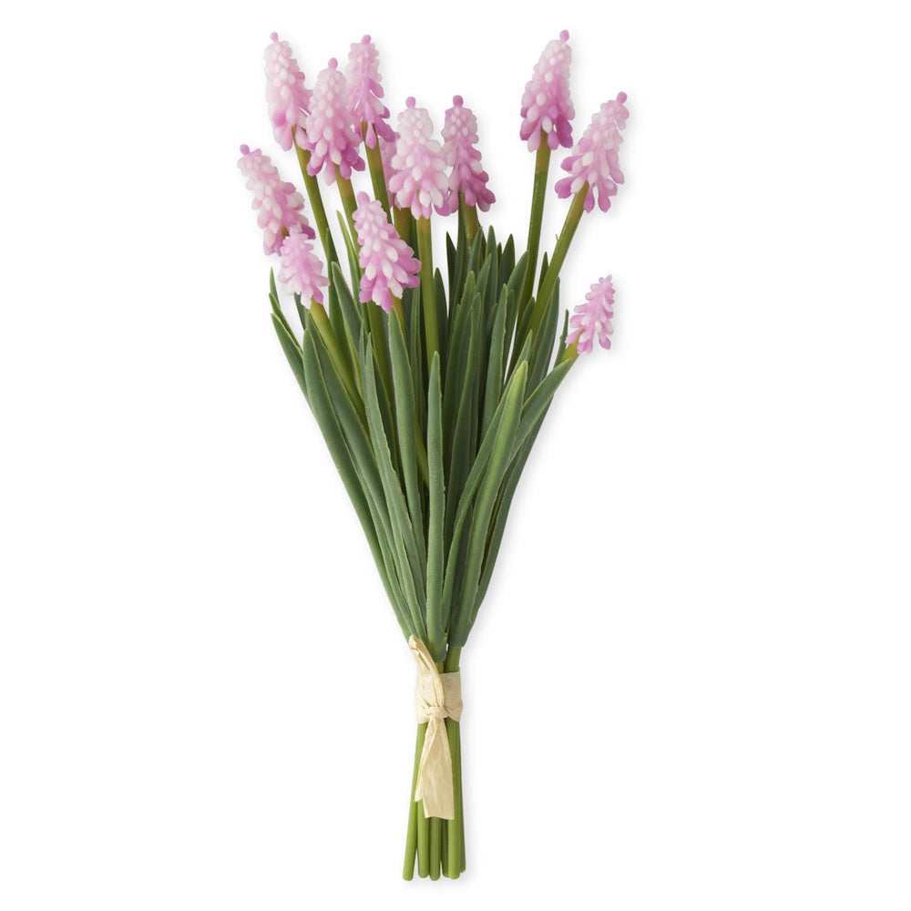 Bundle of 6 artificial pink grape hyacinth stems with green leaves tied with a cream ribbon on a white background.