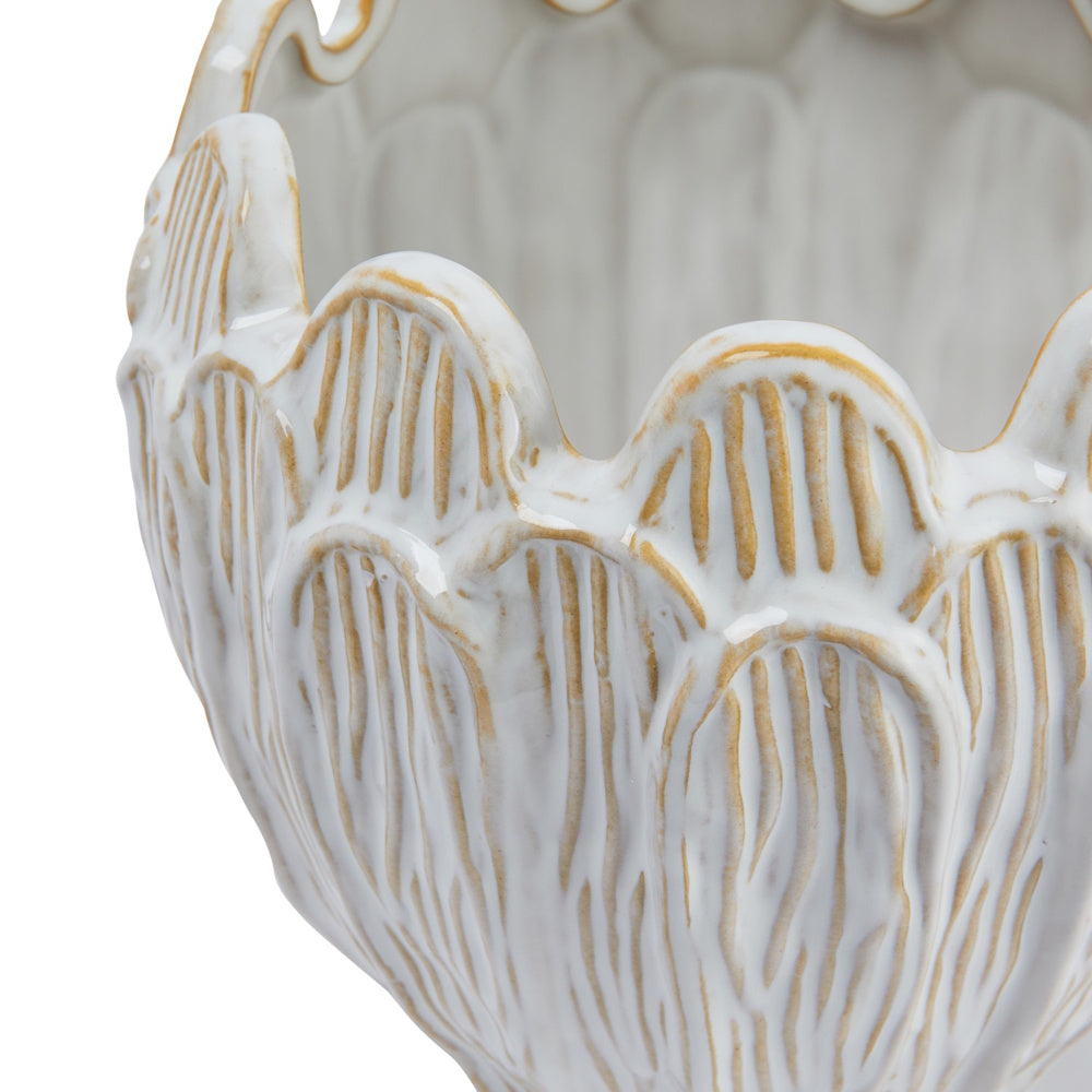 White stoneware flower planter with a scalloped rim and debossed tan vertical textured lines.