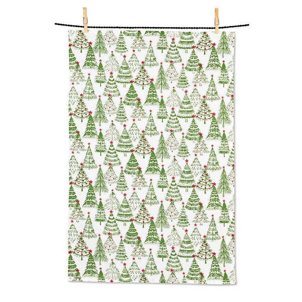 White kitchen towel hanging on a line, featuring a repeating pattern of green Christmas trees.