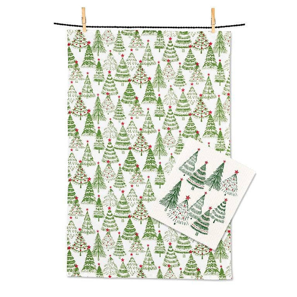 A white kitchen towel and matching dishcloth featuring a green patterned print of decorated Christmas trees.