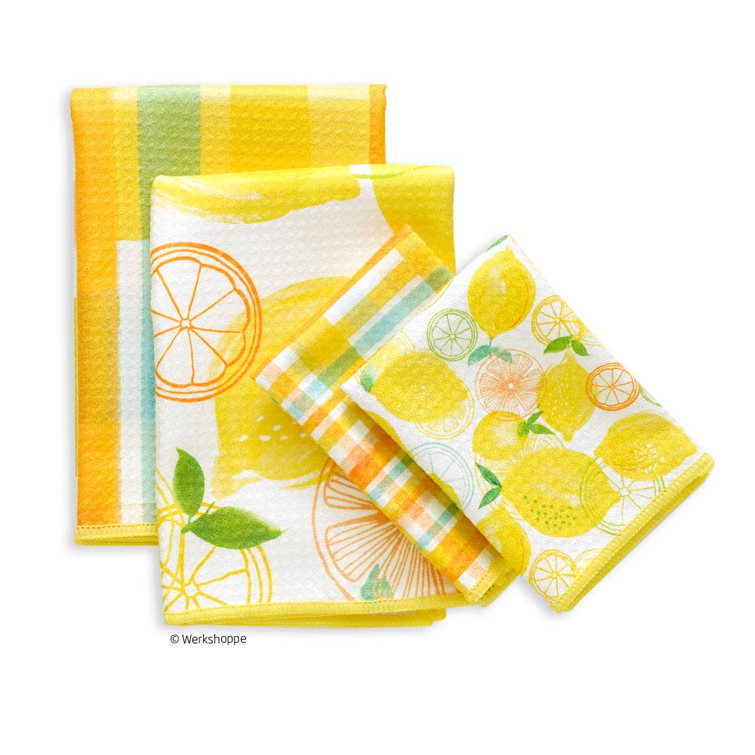 Set of four kitchen towels with lemon and citrus designs on a white background