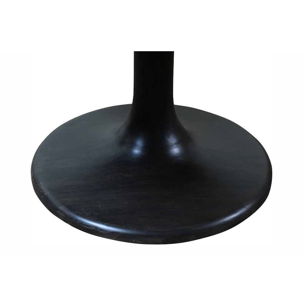 Close up of black pedestal dining table base with smooth rounded platform and sculptural central column design.