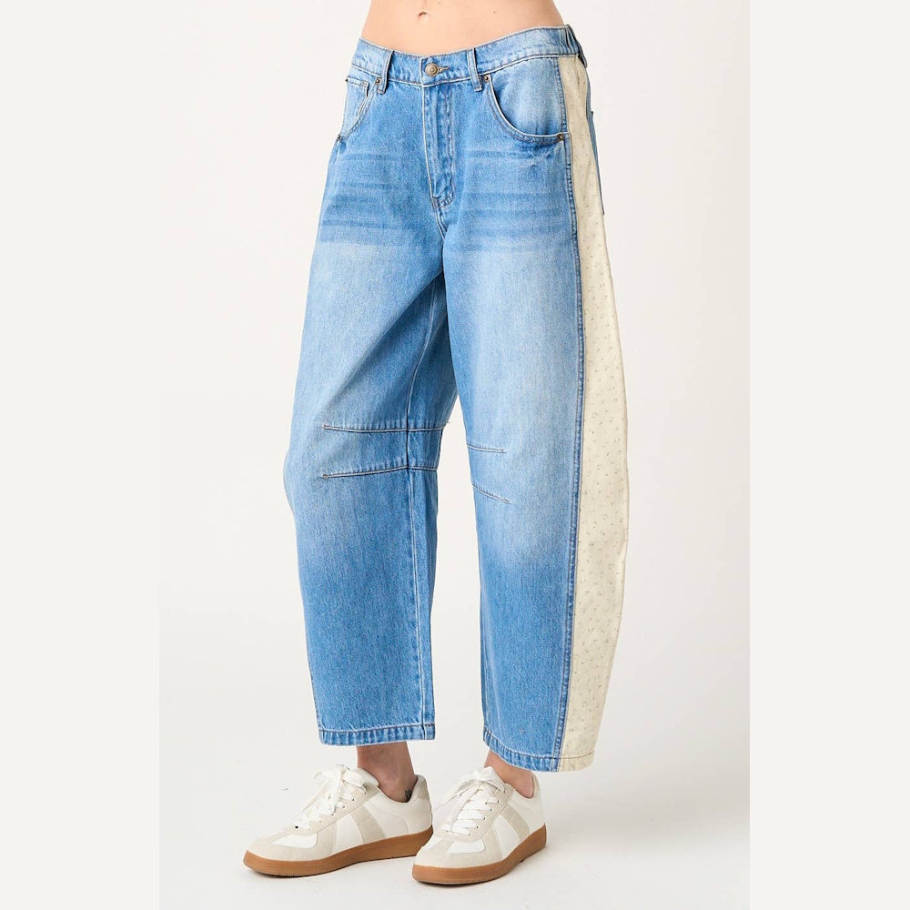 Denim cream floral print contrast elastic waist barrel jeans with a side stripe, paired with white sneakers.