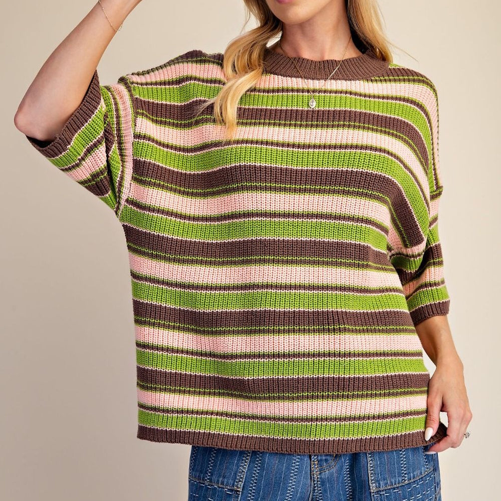 Front view of a striped knit sweater featuring brown, green, and pink horizontal lines.