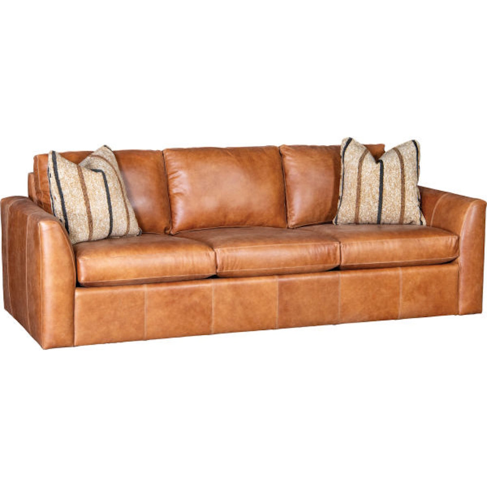 Caramel-colored leather three-seat sofa with two striped accent pillows and a modern silhouette on a white background.