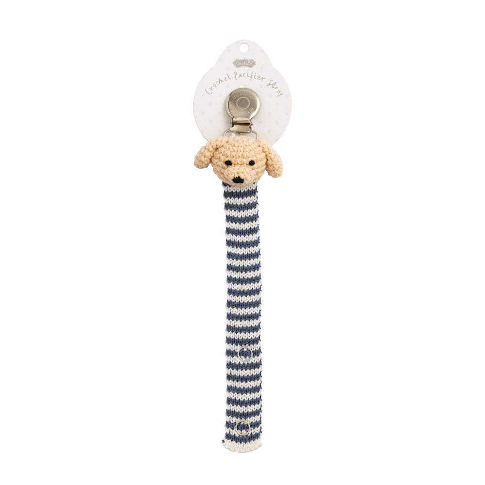 Crocheted tan dog pacifier clip with blue and white striped strap and metal attachment.