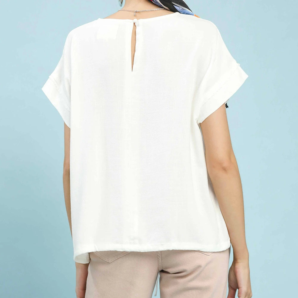 Back view of an off-white linen-blend top featuring short sleeves and a keyhole button closure on the back.