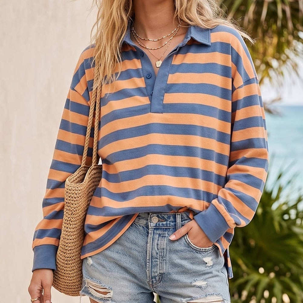 Oversized rugby polo top in blue and orange horizontal stripes with long sleeves and a collared neckline.