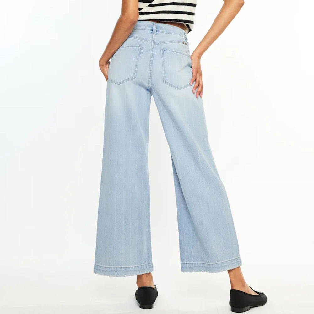 Light wash wide-leg 90s style jeans with subtle vertical stripes, back pockets, and frayed hems on a white background.