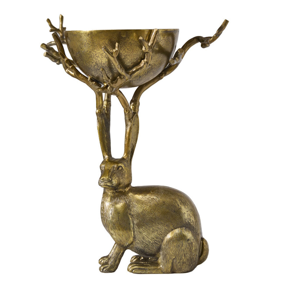 Side view of an antique gold resin rabbit holding up a branch-supported bowl.