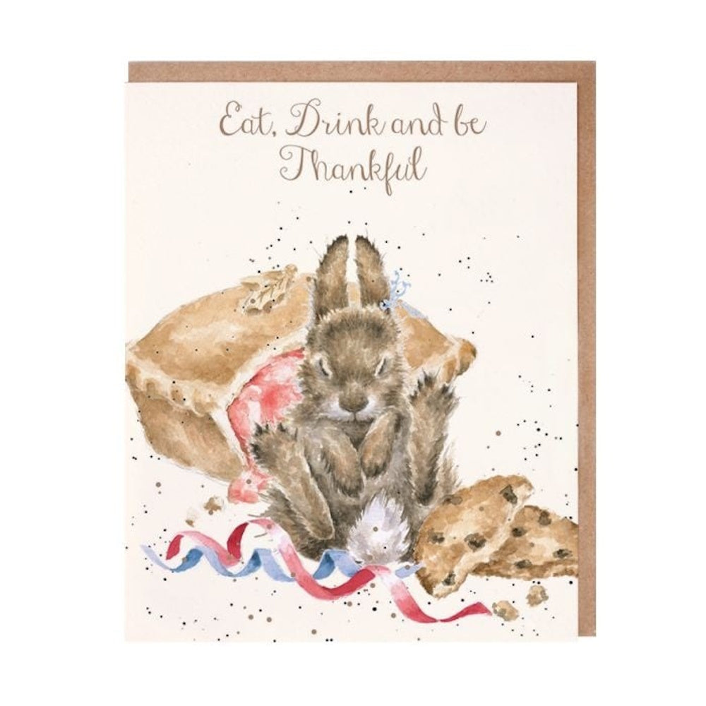 A watercolor card featuring a rabbit sitting among a pie and cookies, reading "Eat, Drink and be Thankful."