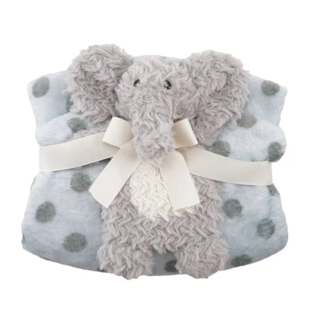 Grey plush elephant toy with a blue polka dot baby blanket and cream ribbon.