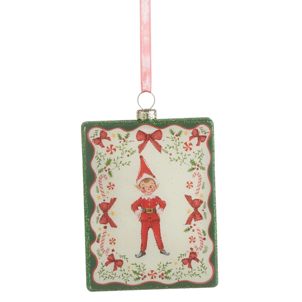 Front view of a rectangular glass Christmas ornament featuring a vintage elf standing with hands on hips.
