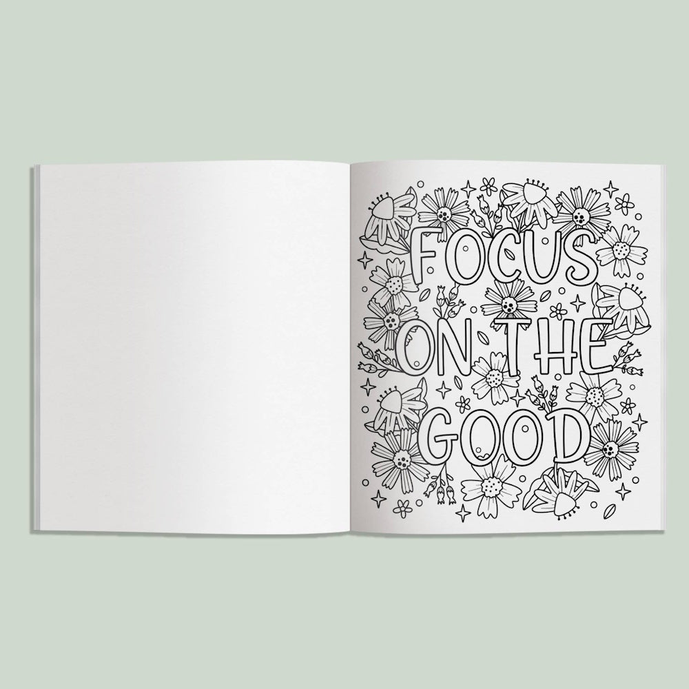 Inspirational coloring book page featuring the quote "Focus on the Good" surrounded by black and white floral line art.