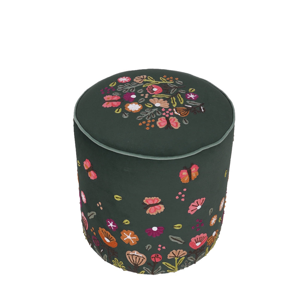 Dark green velvet round ottoman with colorful embroidered floral and butterfly patterns on a white background.