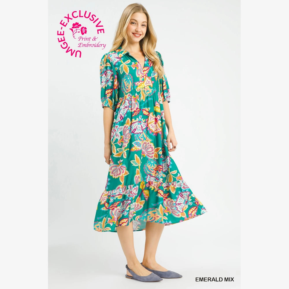 Emerald mix paisley print maxi dress with V-neck and ruffled hem, worn by a woman against a white background.