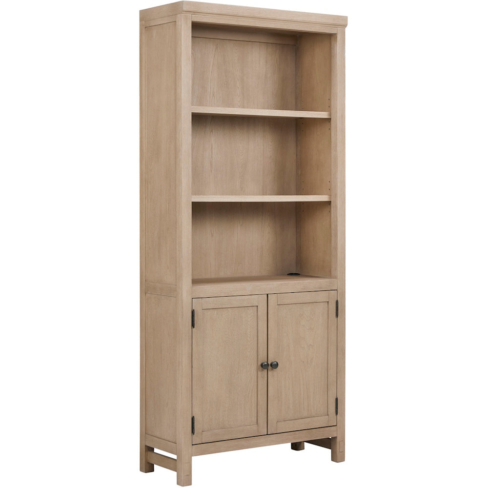 Light oak bookcase with open shelving, double door cabinet storage and clean transitional design for home office use.