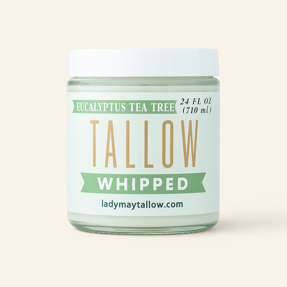 Glass jar of eucalyptus tea tree whipped tallow skincare product with a white lid and mint label.