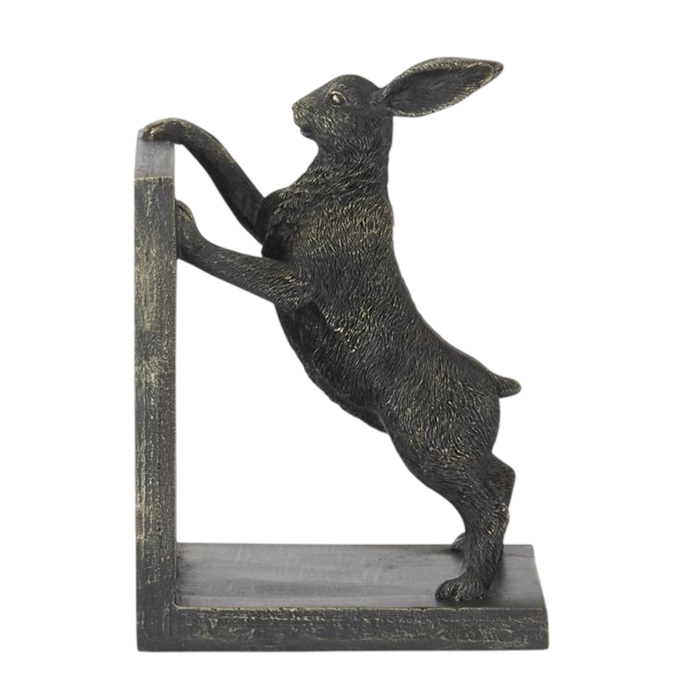 A dark bronze rabbit bookend standing on its hind legs and leaning against an L-shaped support.