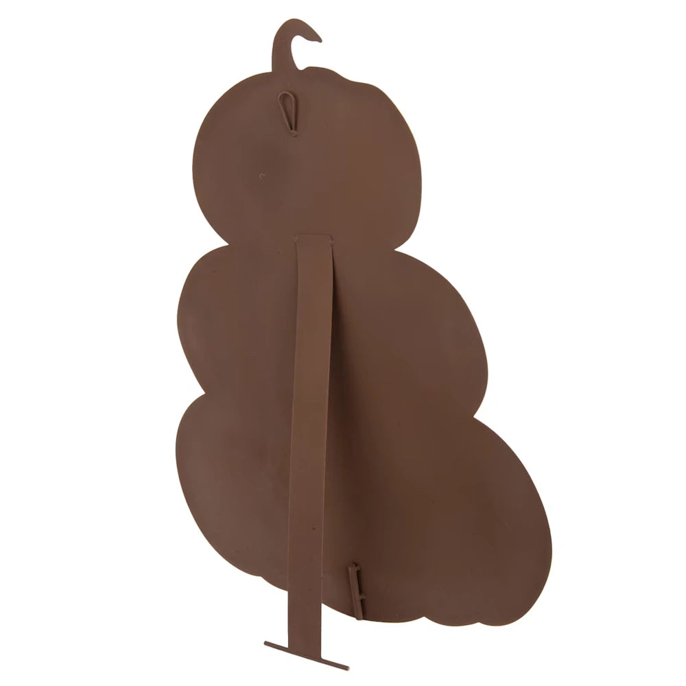 The back of a brown metal stacked pumpkin decoration, showing a supportive easel stand and a hanging loop.