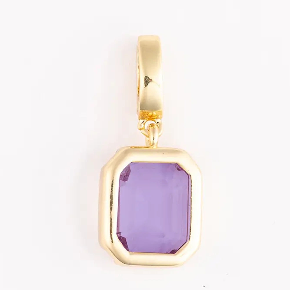 Gold pendant charm featuring a rectangular, emerald-cut purple gemstone set in a bezel frame.