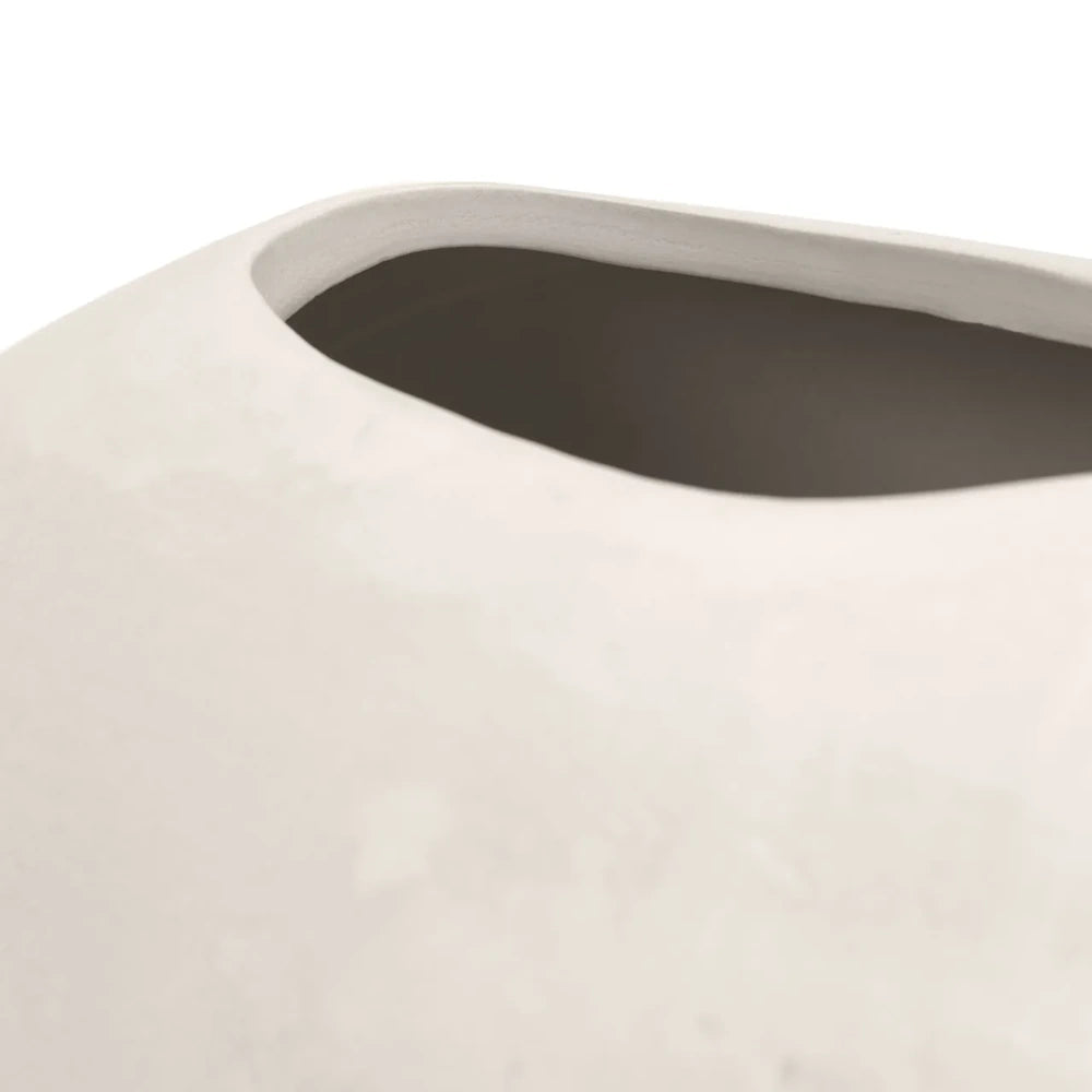 Close-up of the smooth, rounded rim and opening of a minimalist matte white ceramic vase.