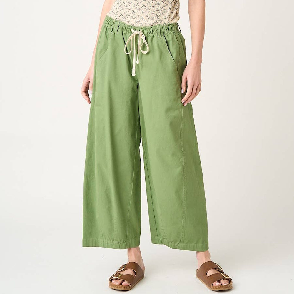 Fern green wide barrel leg pants with a drawstring elastic waist, side pockets, and a relaxed cotton fit.