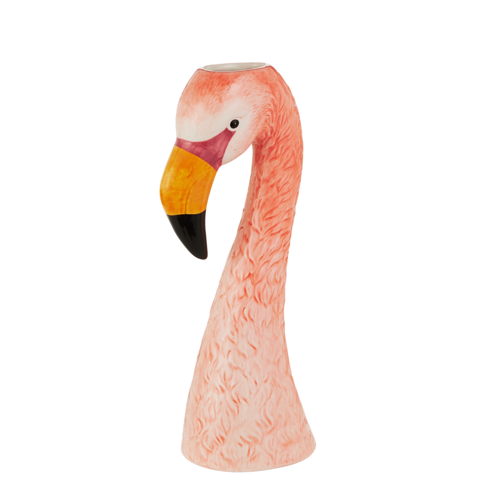 Ceramic vase shaped like a flamingo head and neck, painted in shades of pink with a vibrant yellow and black beak. The mood is playful and artistic.