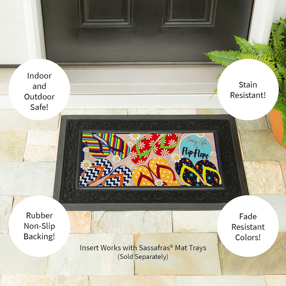 Flip-flop door mat insert in a black tray by a front door, highlighting features like indoor/outdoor safe.