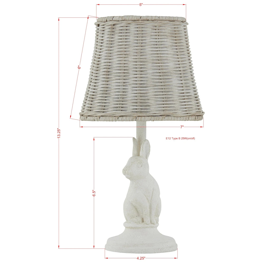 Rabbit base accent lamp in distressed white resin, featuring a grey hand-woven wicker shade and E12 socket, measures 13.25"H.