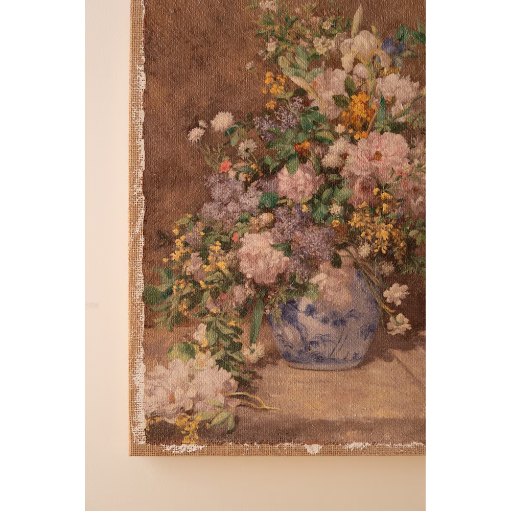 Close-up detail of a floral burlap canvas print featuring colorful flowers in a blue and white vase.
