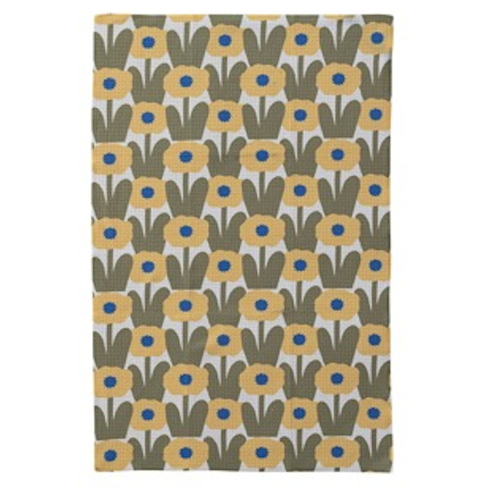 Flat tea towel featuring a repeating pattern of yellow flowers with blue centers and green leaves.