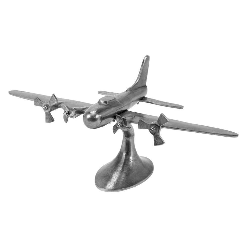 Silver vintage-style metal airplane sculpture on a stand, featuring a four-propeller design against a white background.