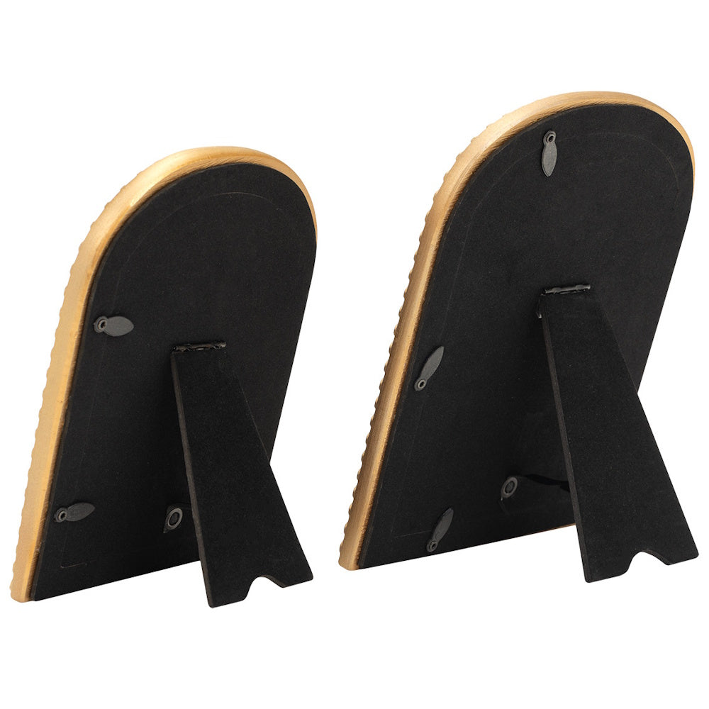 Back view of two gold arched picture frames with black velvet backing and easel stands for tabletop display.