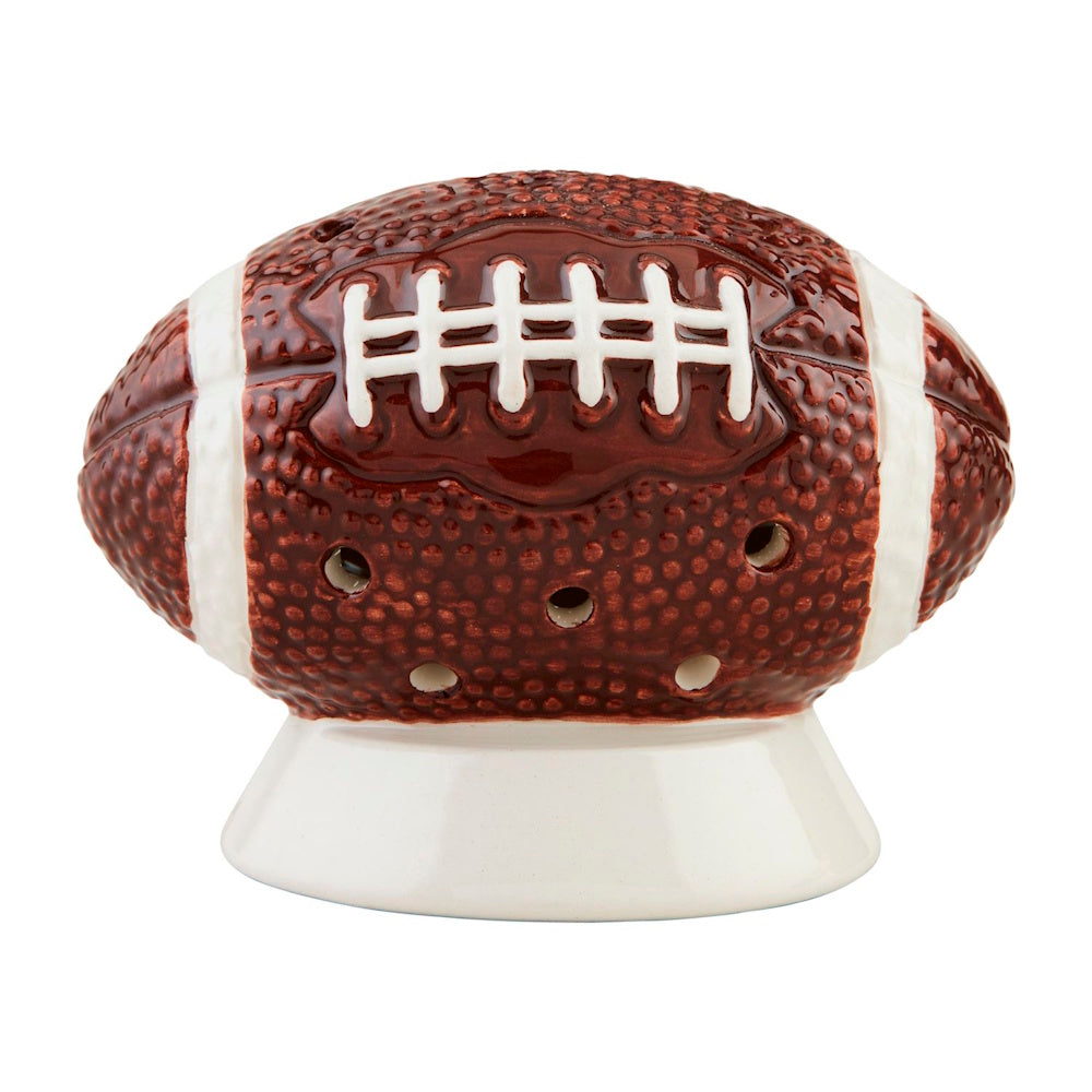 Ceramic football table decor featuring white stripes, white laces, cut-outs, and a pedestal base.