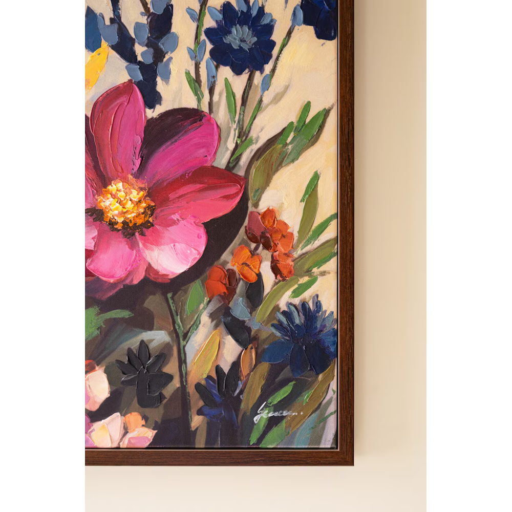 Close-up detail of dark pink and blue impasto painted flowers with artist signature in lower right.