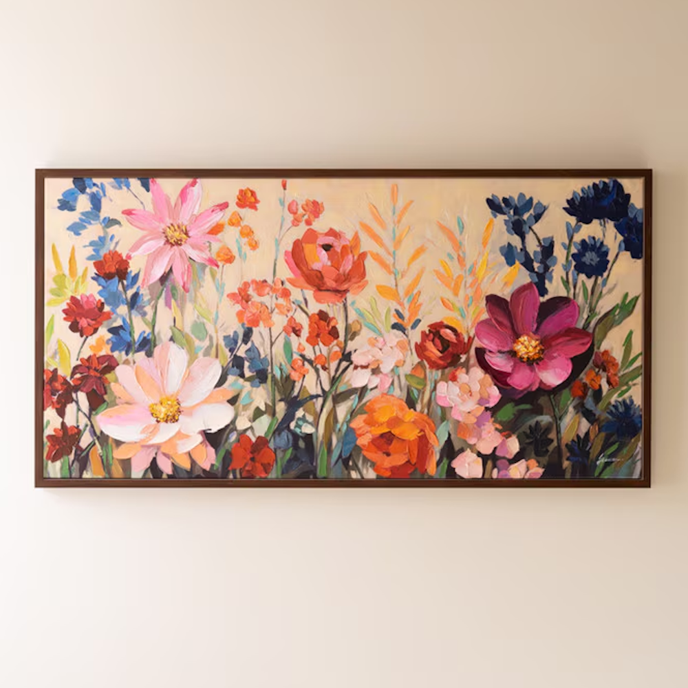Framed panoramic canvas painting featuring colorful, impasto-style wildflowers against a cream wall.