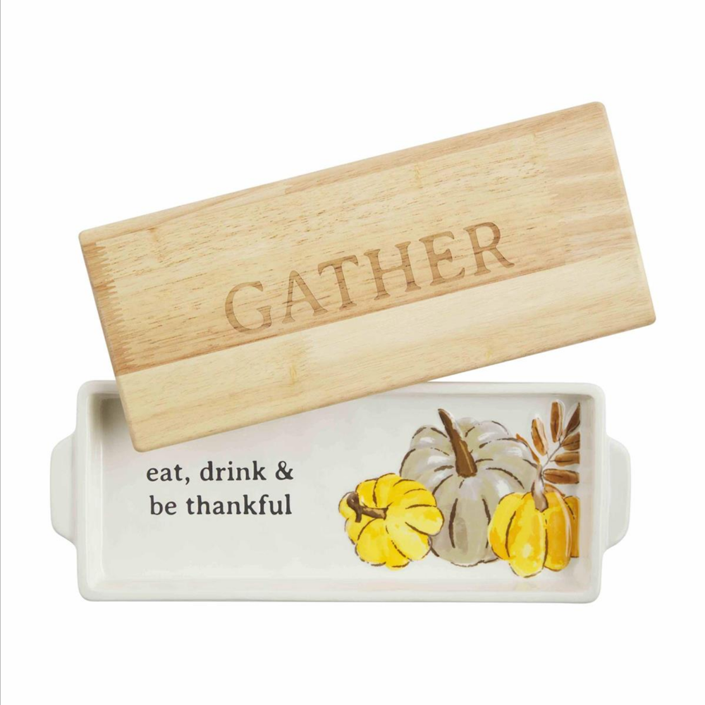 Rectangular ceramic dish with pumpkin design and wooden board lid engraved with "GATHER".